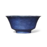 A Chinese porcelain powder blue-glazed bowl, Kangxi period, on short straight foot, covered in a