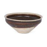 A Chinese Cizhou-type iron brown-glazed tea bowl, Northern Song dynasty, the conical bowl with a