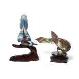 Two Chinese export silver gilt and enamel birds, mid-20th century, modelled perched atop wood bases,