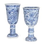 Two Chinese porcelain blue and white goblets, Kangxi period, both atop tall splayed stems, painted