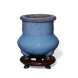 A Chinese porcelain jun-type tripod censer, 19th century, the compressed globular body rising to a
