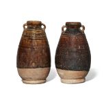 A pair of Thai Sawankhalok pottery brown-glazed small jars, 15th/16th century, with ribbed shoulders