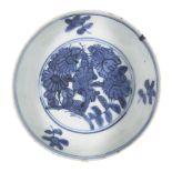 A Chinese blue and white porcelain 'flowers' dish, Wanli period, painted to the interior with