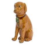A Chinese export porcelain yellow-glazed figure of a dog, 18th century, modelled seated, with a