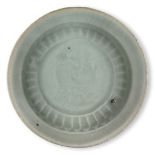 A Chinese porcelain qingbai small dish, Song dynasty, with moulded design to the central reserve