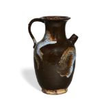 A Chinese stoneware phosphatic splash-glazed ewer, 20th century, with loop handle opposite a short