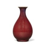 A small Chinese stoneware flambé vase, yuhuchunping, 18th century, the pear-shaped body atop a