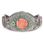 A Chinese coral-inset and enamelled silver bracelet, early 20th century, inset with a coral plaque