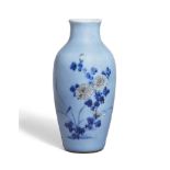 A Chinese porcelain pale blue-glazed 'chrysanthemum' vase, Republic period, painted with flowering