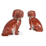 A pair of Chinese export porcelain iron red glazed figures of spaniels, Qianlong period, each