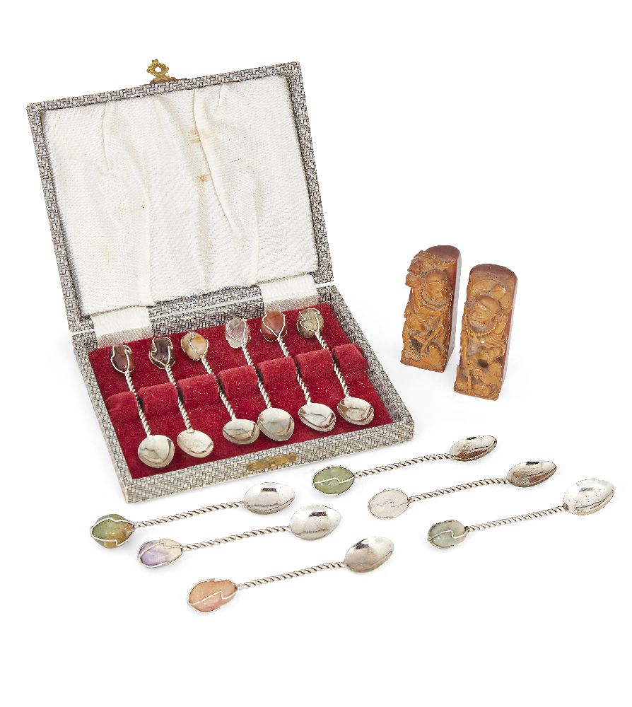 A pair of Chinese carved soapstone seals and twelve hardstone-inset white metal teaspoons, 20th