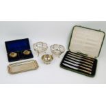 A small group of silver comprising: a cased set of two Victorian silver shell salts with spoons,