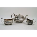 A matched Georgian three piece tea set, the teapot London, 1825, Joseph Angell II, the sugar and