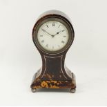 An Edwardian tortoiseshell timepiece, early 20th century, of balloon form, with white painted dial