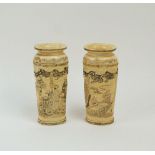 A pair of Japanese Meiji Period ivory vases, late 19th century, with tapering bodies and