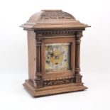 A German walnut cased eight day bracket clock, late 19th century, the square brass dial with