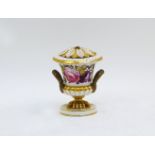 A Derby twin handled urn and cover, 18th century, painted with flowers and with gilt detailing,