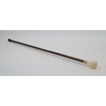 A faux ivory and beech walking stick, late 20th century, the knop handle with twisted carving,