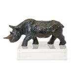 A modern bronze model of a rhino, artist's monogram TT, 2012, on a perspex plinth, 24cm wideGood,