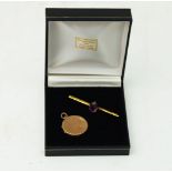 Two items of jewellery, comprising: an Edwardian gold amethyst coloured paste mounted bar brooch;