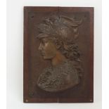 A pair of spelter Classical portrait relief plaques, late 19th/early 20th century, in the