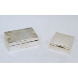 Two silver cigarette boxes, the larger rectangular example designed with engine turned lid, c.