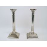 A pair of large silver plated Corinthian column candlesticks, Sheffield, James Pinder & Co.,