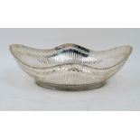A pierced Dutch cake basket, 20th century, stamped for .835 standard silver, of shaped oval form