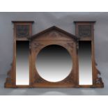 An Art Nouveau oak over mantle mirror, with two copper panels and three beveled glass plates, 98 x