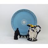 A Wedgwood blue Jasperware charger, decorated with floral swags busts, incised marks to underside,