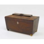 A 19th century mahogany sarcophagus tea caddy, in the regency style, with ivory escutcheon to front,