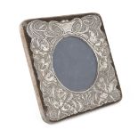 A silver mounted Edwardian Art-Nouveau photo frame, Chester, 1905, William Neale, the square brown