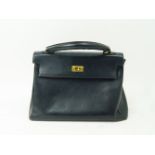 Hermes, Paris, a Hermes 32cm Kelly bag, the black leather with gold tone hardware, blind stamp R