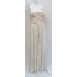 Madame Gres, a fine pleated cream jersey evening gown, with asymmetric boned bodice, labelled