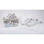Jimmy Choo: a pair of Hawaii white leather lace-up trainers with star detailing to the front,