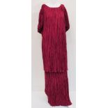 A collection of evening gowns to include a Mary McFadden burgundy Fortuny inspired pleated top and
