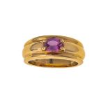A pink sapphire ring, by Boucheron, centring on an oval mixed-cut pink sapphire to a fluted mount,