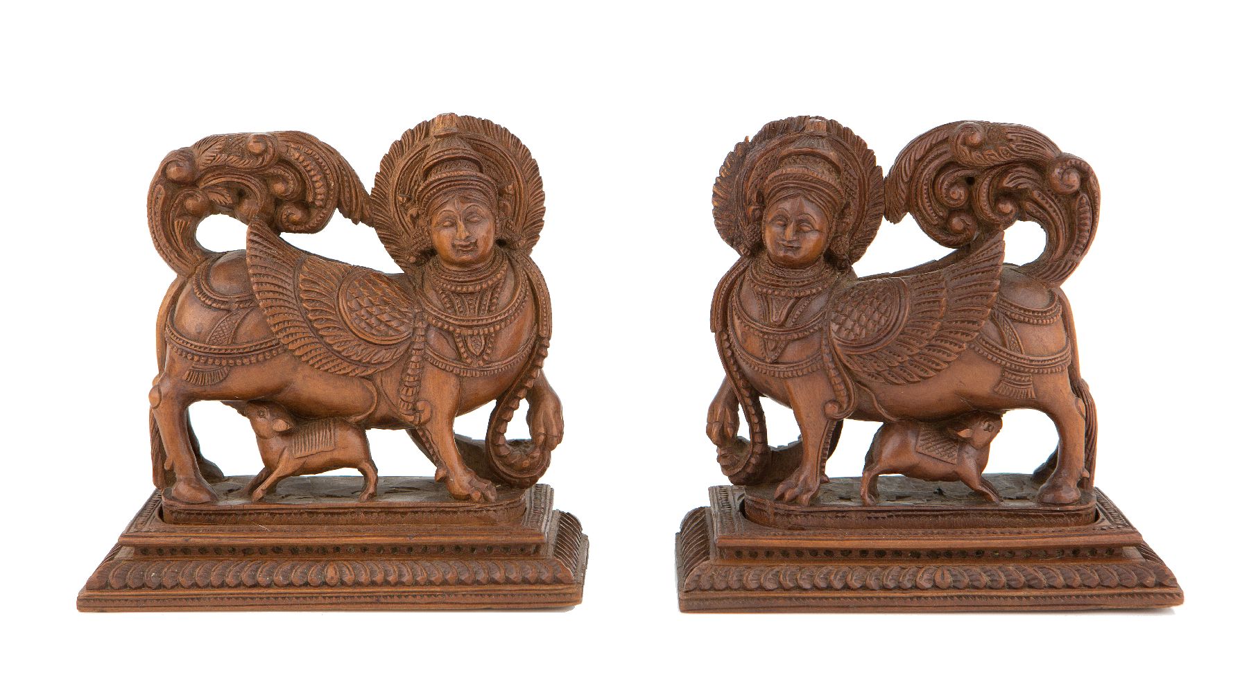 Two carved wood figures of Kamadhenu, the wish-granting cow, Mysore, India, 19th century, each on