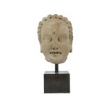 A Greek style terracotta of Buddhist Donor, Gandhara, 3th-4th century, the mouth depicted open and