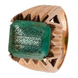 An inscribed emerald set into a gold ring, India, 20th century, the emerald of rectangular form with
