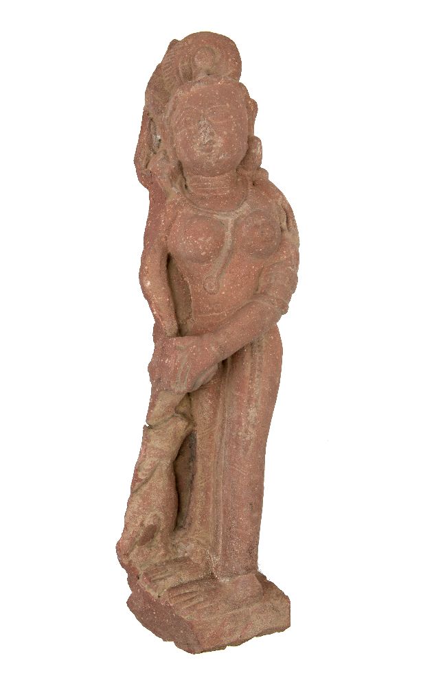 A red sandstone figure of an attendant, Central India, 12th century, carved with the female figure