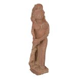 A red sandstone figure of an attendant, Central India, 12th century, carved with the female figure