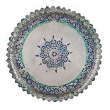 A Lucknow silver engraved and enamelled dish, India, 19th century, of shallow, rounded form on three