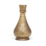 An engraved brass vase, India, early 19th century, of drop-shaped form on a spreading foot, engraved