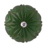 A carved jade button with central diamond, India, 19th century, of round form carved in the form