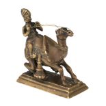 A brass model of a camel and rider, in the style of Vizagapatam, India, 19th century, mounted on a