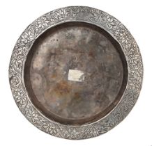 An early Mughal chased and repousse work silver dish, India, late 16th-early 17th century, of deep