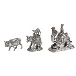 A figure mounted on a camel, an elephant with howdah and a figure of a bull, India, late 19th-