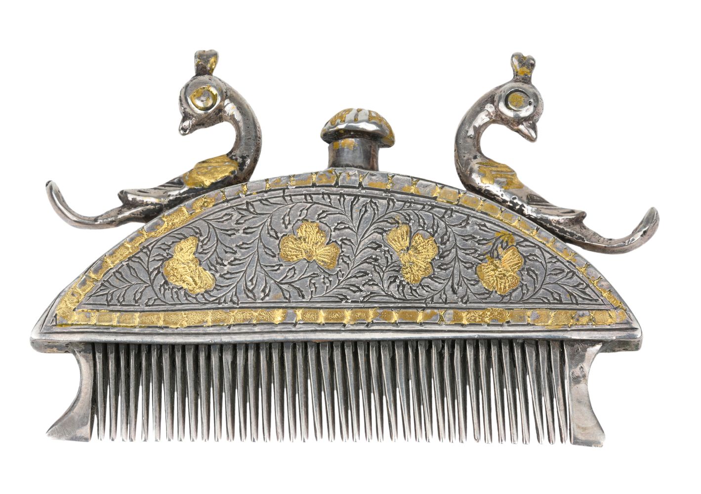 A gilt-decorated silver hair comb, Kutch, India, mid-19th century, the hemispherical body surmounted