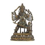 A bronze figure of Durga killing the buffalo demon, Nepal, late 19th-early 20th century, the